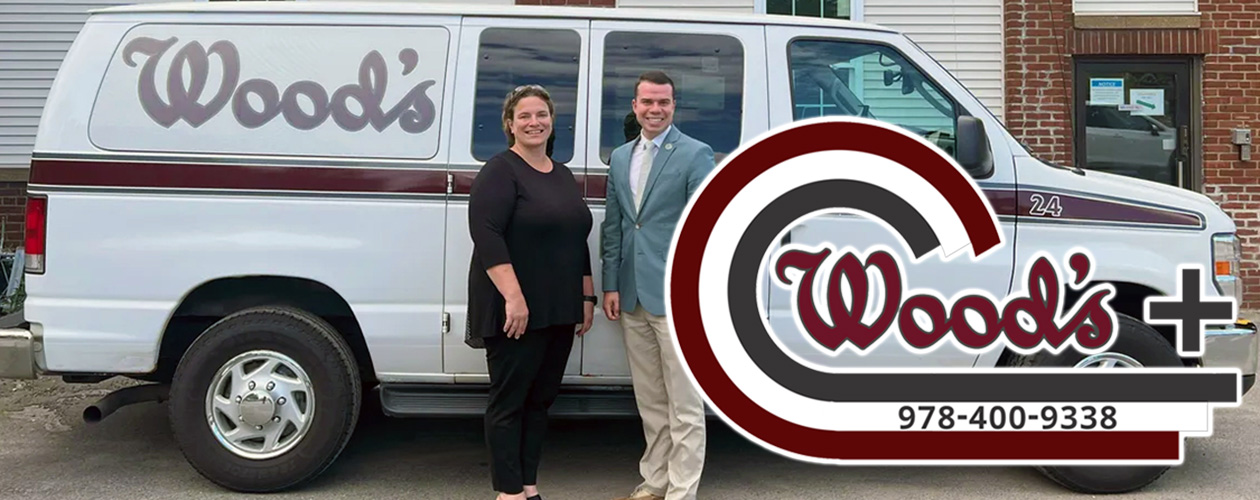photo of a Wood's Plus Swift Ride Van and Jen Wood and Mayor Michael J. Nicholson